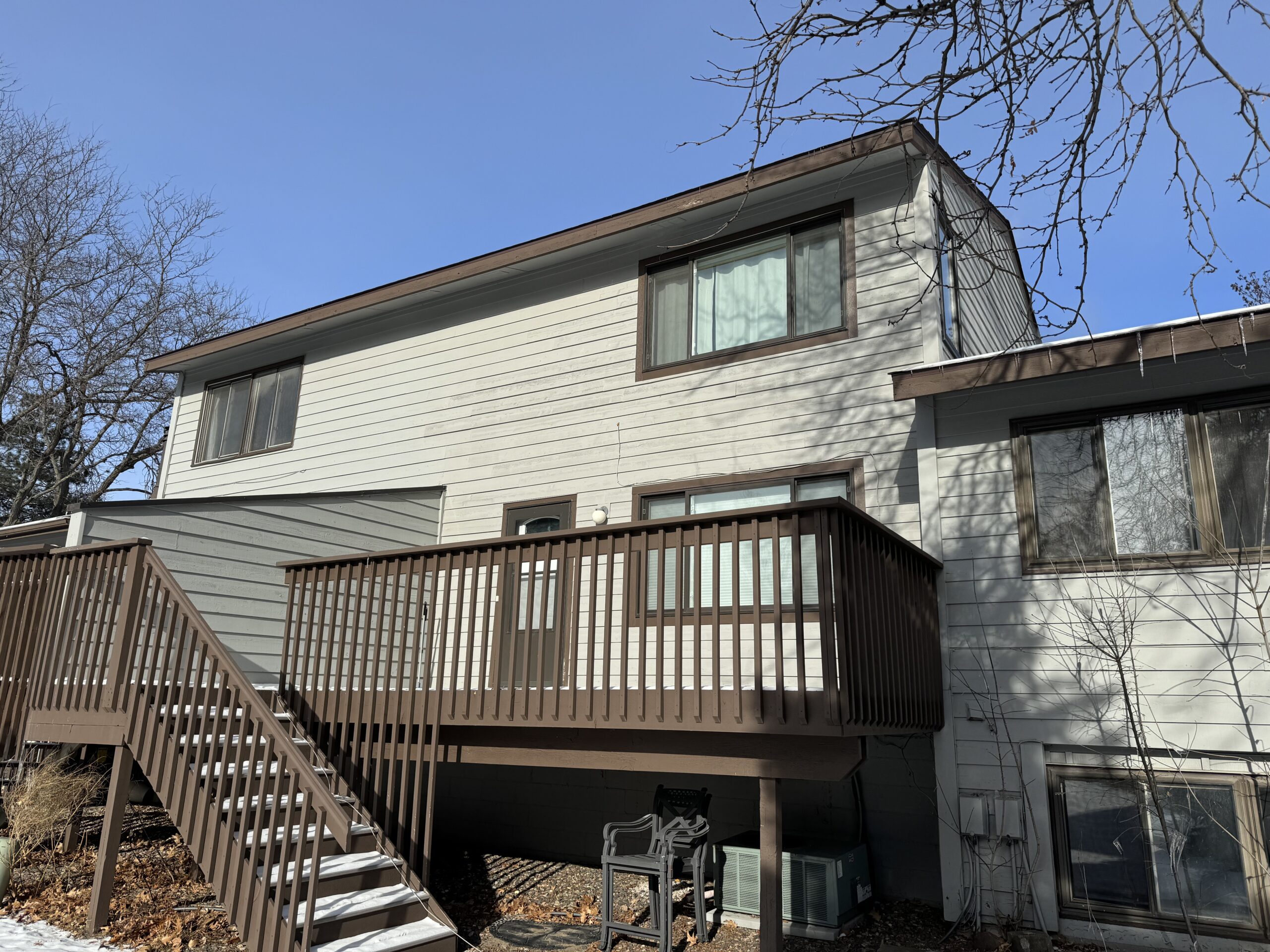 freshly painted deck and new siding on minnesota home
